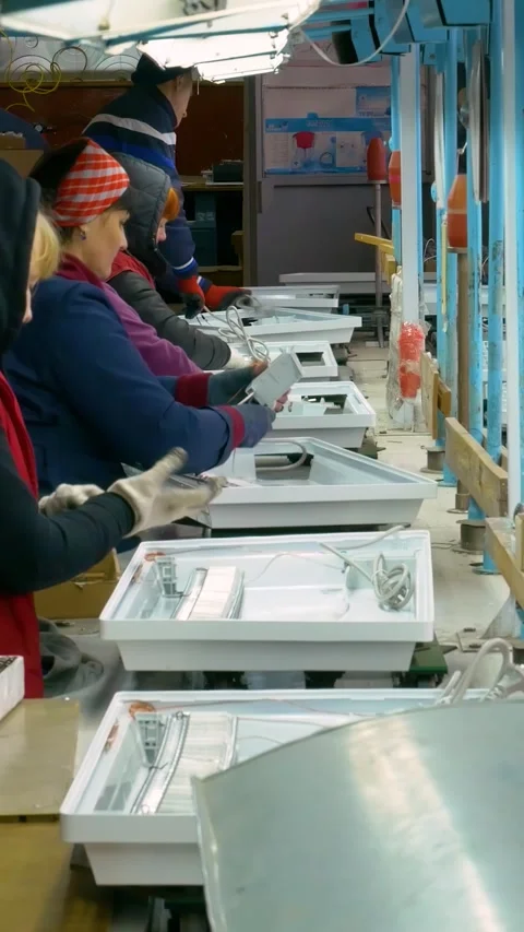 Manual assembly conveyor. Vertical video. Stock Footage 269664541