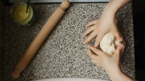 Manual bread dough kneading Stock Footage 303842368