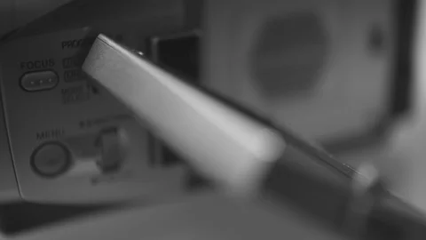 Manual button dial of a mini dv camcorder camera, close up macro shot Stock Footage 111589348