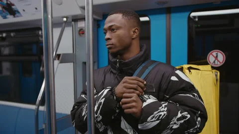 Manual camera. A man rides the subway and adjusts a yellow backpack Stock Footage 239322879