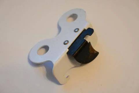 Manual can opener on a light surface Stockfoto's