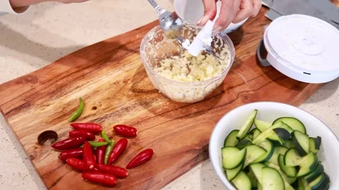Manual Chopper Prepares Garlic in Kitchen Setting Stock Footage 307392699