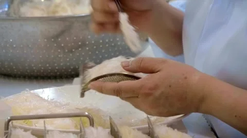 The manual cleaning process of edible bird's nests (yanwo) Stock Footage 340456485
