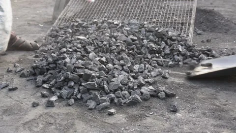 Manual Coal Sorting on Mesh Screen Stock Footage 326149142