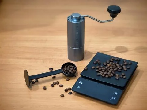 Manual Coffee Grinder, Digital Scale and Roasted Beans for Home Brewing Setup Photos