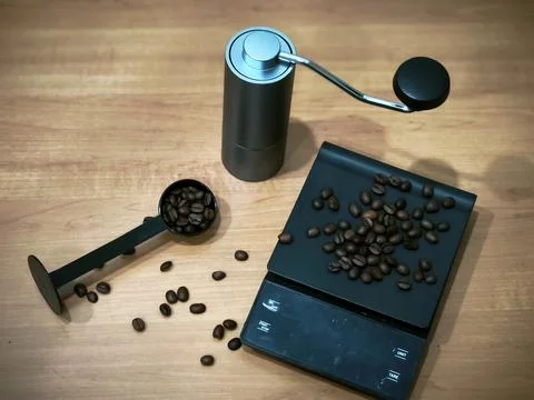 Manual Coffee Grinder, Digital Scale and Roasted Beans for Home Brewing Setup Photos