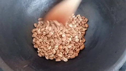 Manual Coffee Roasting Process with Traditional Method Stock Footage 341737470
