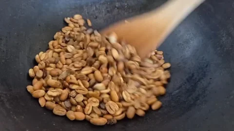 Manual Coffee Roasting Process with Traditional Method Stock Footage 341737940