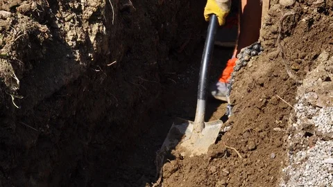 Manual digging of a pit in soil. Stock Footage 95591536