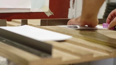 Manual folding of paper by a white man in a printing house Stock Footage 80465700