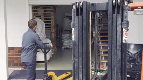 Manual forklift inside warehouse Stock Footage 131125633
