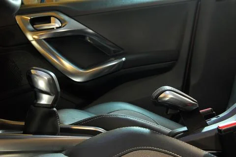 Manual gear shift handle and handbrake Stock Photos