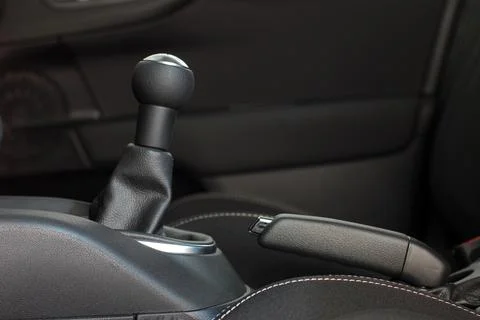 Manual gear shift handle and handbrake Stock Photos