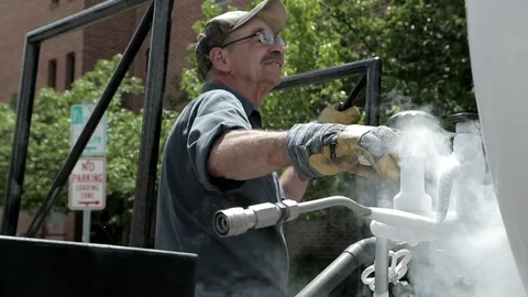 Manual Labor Working with Liquid Nitrogen Stock Footage 100074887