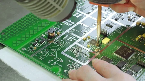 Manual making of a computer microchip Stock Footage 128779963