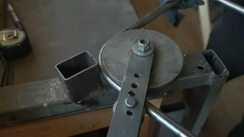 Manual Metal Bending Tool on Workbench Stock Footage 308828884