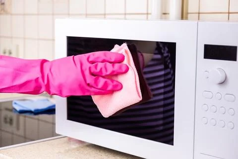 Manual microwave cleaning Stock Photos