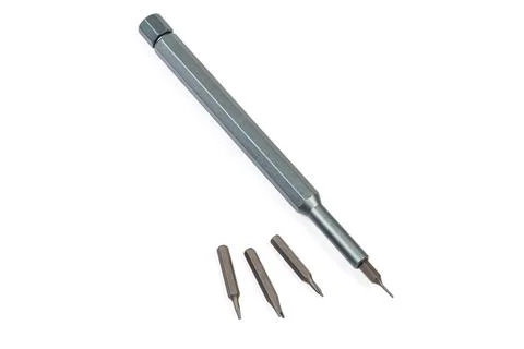 Manual mini screwdriver and different interchangeable bits close-up Foto stock