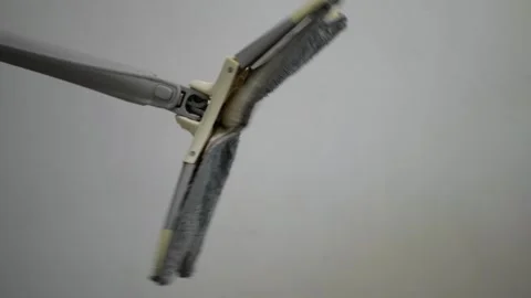 Manual mop automatic wringing rotating squeezing hand dry fibers spinning motion Stock Footage 320896057