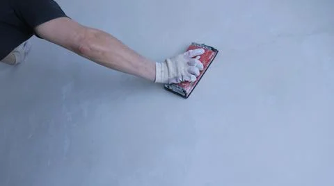 Manual power processing of the wall with emery Stock Photos