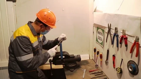 Manual processing of the part squeezed in a vice Stock Footage 84814389