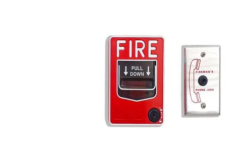 Manual pull fire alarm switch safety system box installed and fire extinguish Stock Photos