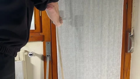 Manual roller shutter broken and needs repairing. Belt spring problems Stock Footage 306040837