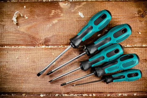 Manual screwdrivers on the table. Stock Photos