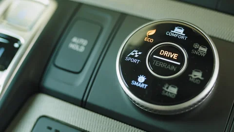 Manual selection of driving modes sport, eco, comfort button on a modern SUV Video stock 240284533