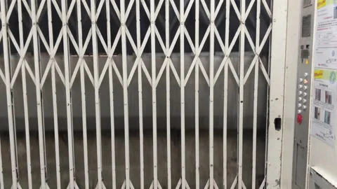 Manual Steel Gate Of An Antique Elevator Going Up Inside A Building. close Stock Footage 165647973