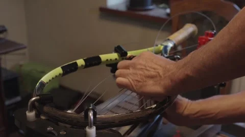 Manual stringing of a tennis racket on machine Video stock 317872324