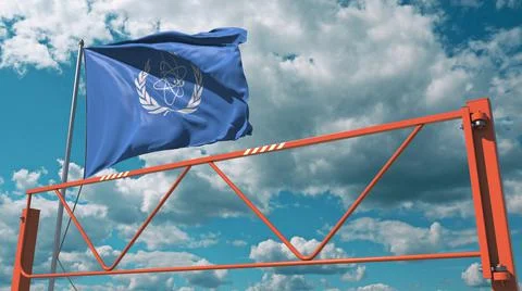 Manual swing arm road barrier and flag of the IAEA. Editorial restrictions Stock Illustration