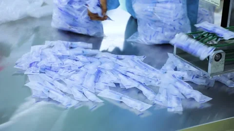 Manual syringe packaging Stock Footage 163088175