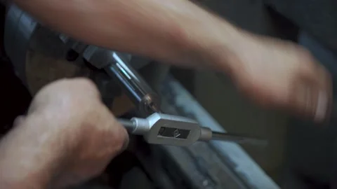 Manual thread cutting on lathe machine, close-up of skilled metalworker hands Stock Footage 306179695