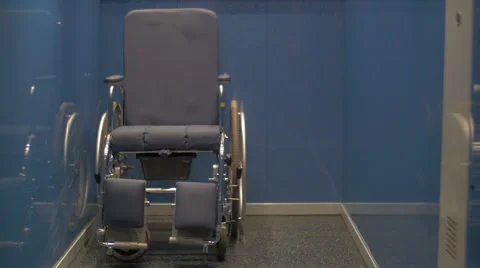 Manual wheelchair left alone in the elevator Stock Footage 46966733