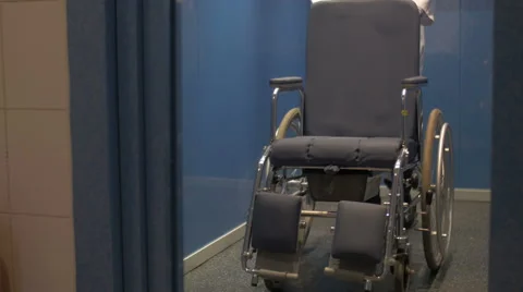 Manual wheelchair out of the elevator Stock Footage 46966610