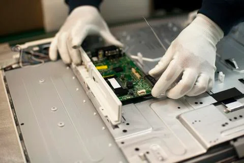 Manual work in electronic industry Stock Photos