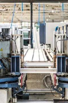 Manual worker assembling glass panels for PVC windows. Manufacturing jobs. Stock Photos