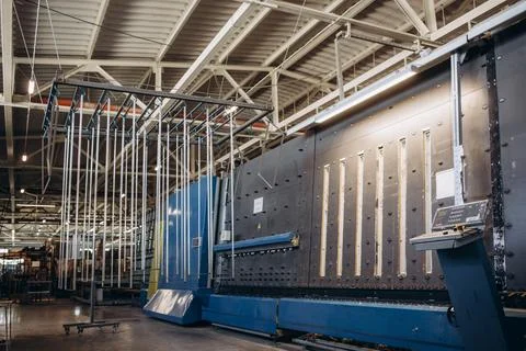 Manual worker assembling PVC doors and windows. Manufacturing jobs. Selective Stock Photos