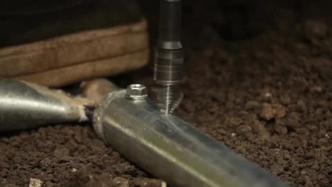 Manual worker assembling the structure of resistance Stock Footage 243708167