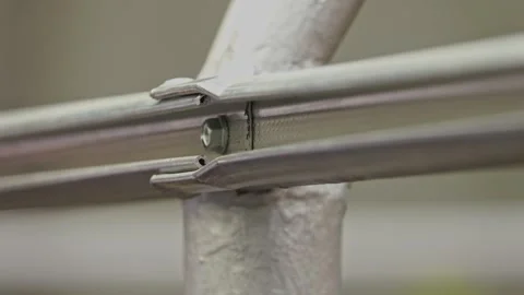 Manual worker assembling the structure of resistance Stock-Footage 243708375