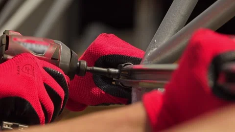 Manual worker assembling the structure of resistance Stock-Footage 243708488