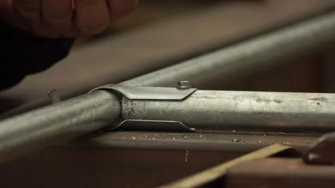 Manual worker assembling the structure of resistance Stock-Footage 243708533