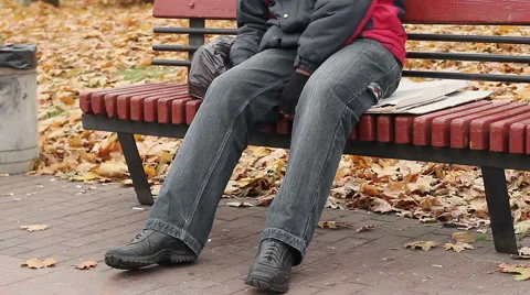 Manual worker sleeping drunk on bench, problems with health, unhealthy lifestyle Stock Footage 63215823