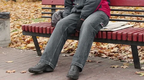 Manual worker sleeping drunk on bench, problems with health, unhealthy lifestyle Stock Footage 63223561
