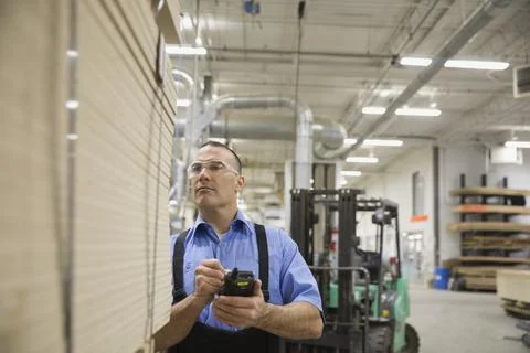 Manual worker using bar code reader in warehouse 写真素材