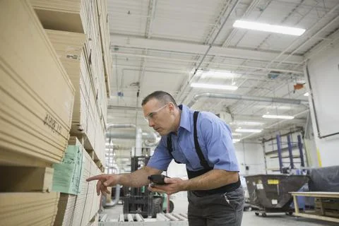Manual worker using bar code reader in warehouse Stock Photos