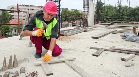 Manual Worker Using Hammer at Construction Site Stock Footage 31872769