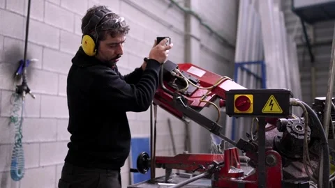 Manual worker using a milling machine in a cnc factory Stock Footage 260013413