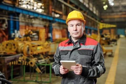 Manual worker using tablet pc Stock Photos